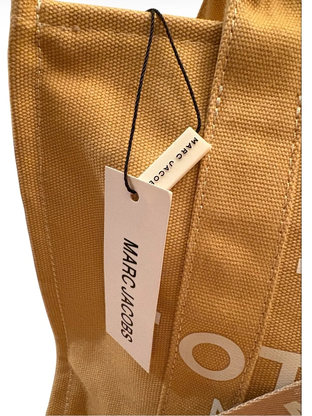 Marc Jacobs The Jacquard Tote Bag in the color Camel.